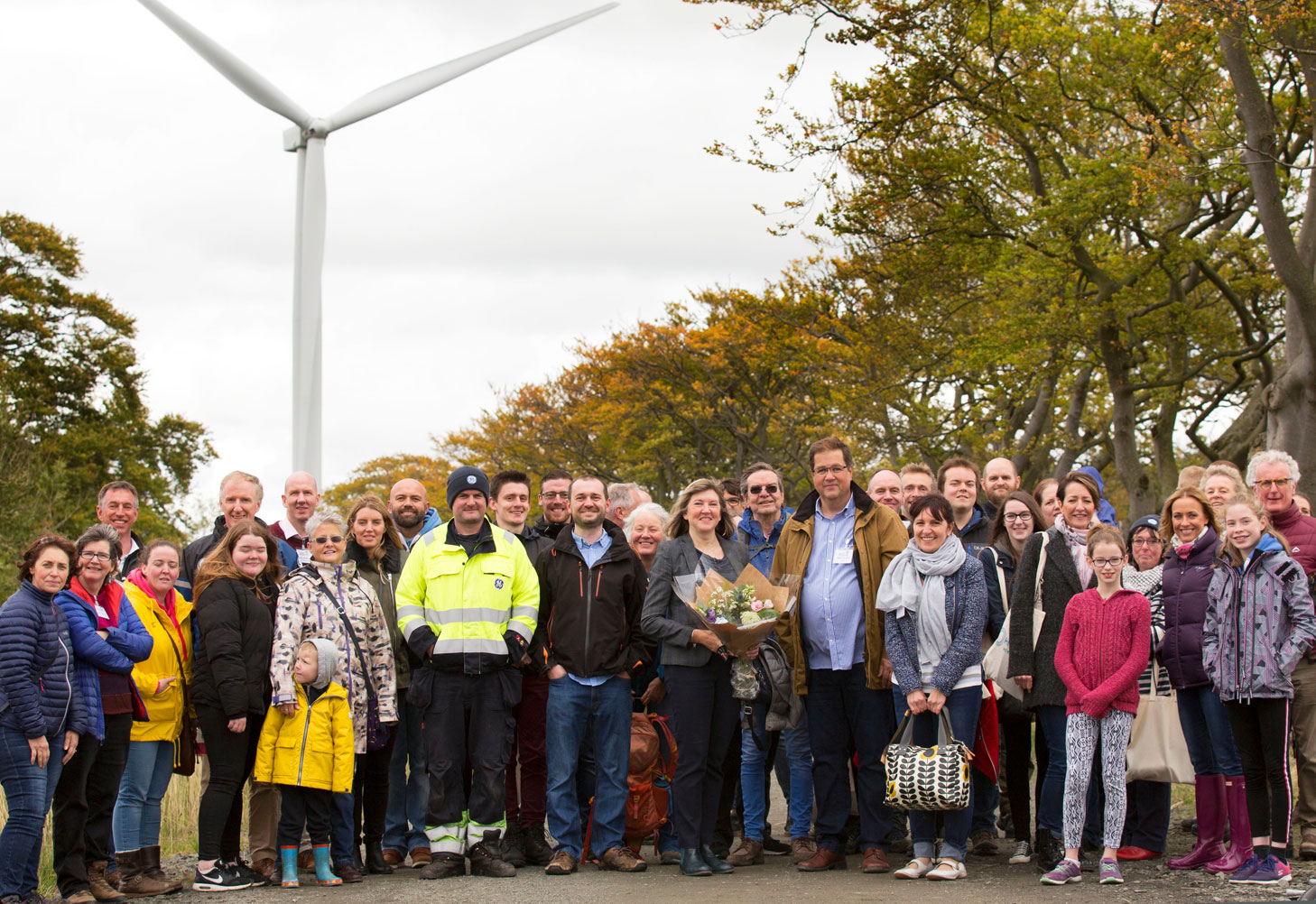 DC25-Group-with-turbine-in-background-1-2
